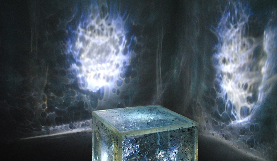 A glowing cube and light on walls