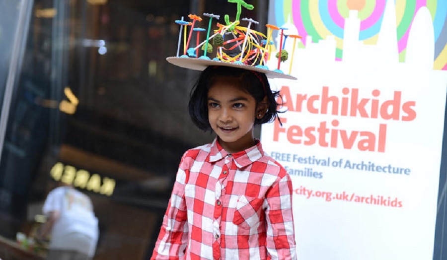 child wearing hat with sculpture on it