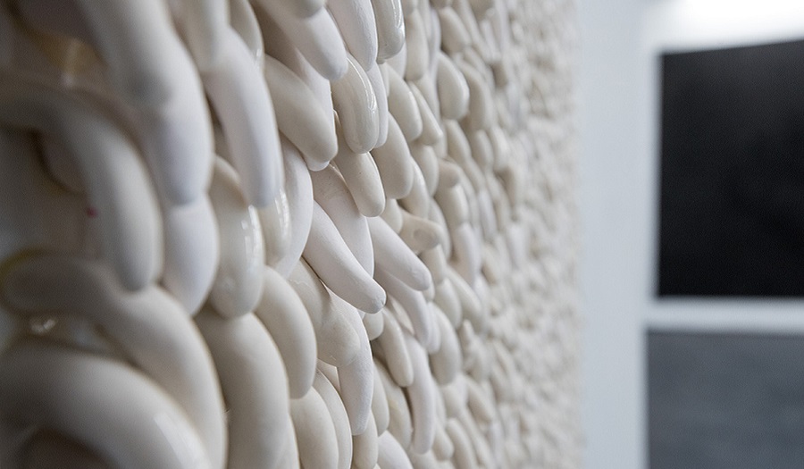 detail of porcelain artwork hanining in a gallery