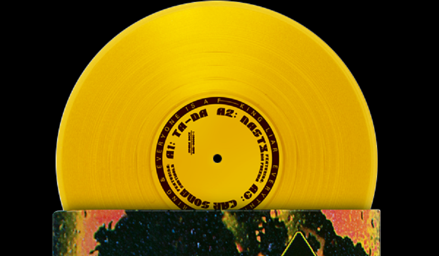 Yellow vinyl disc coming out of sleeve