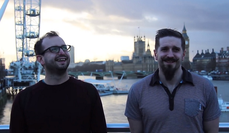 Two happy men, one with a waxed moustache