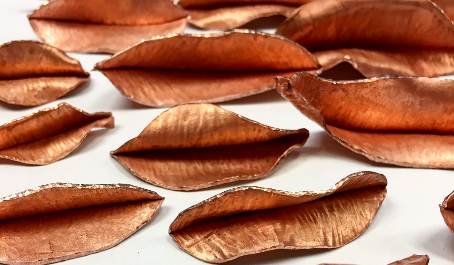 Close up of folded leaves made of copper