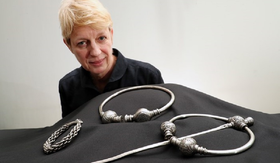 woman behind jewellery display