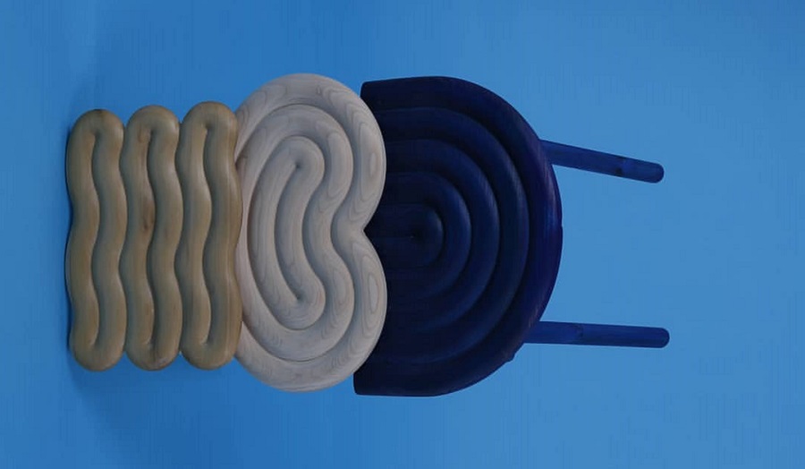 three wavy stools interlocked against blue background