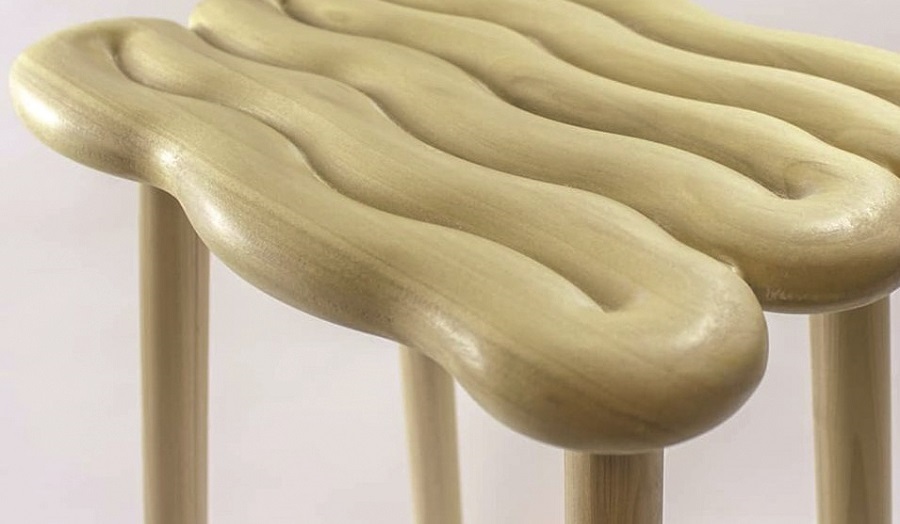 close up of wooden stool with squiggly seat