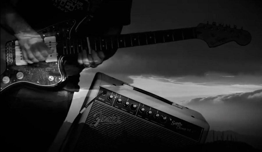 A guitar player with a transistor flying over the sky full of clouds