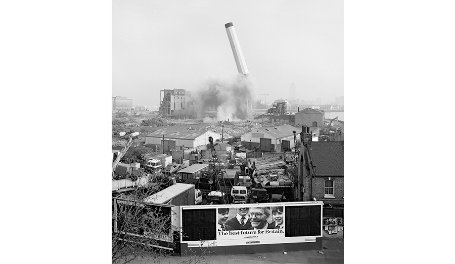 The sight of a factory chimney being blown up together with a billboard that reads, The best future for Britain