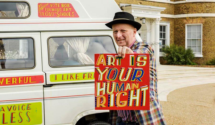 Bob and Roberta Smith with placard that reads 