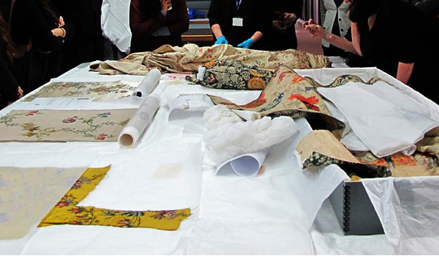 Collection of fabrics displayed on a table