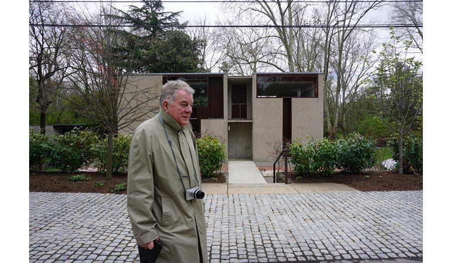 Man walking on a pebble stone street