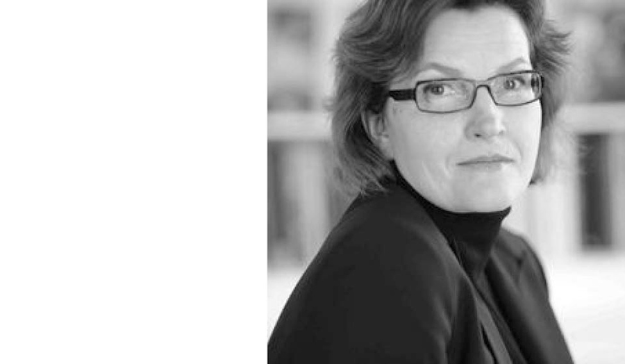 Black and white portrait of Gabriele Bryant taking the half right side of the picture
