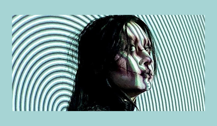A woman's face from the side with a swirling lines graphic on the background