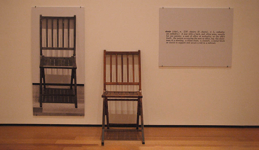 An exhibition of a chair, a photo of a chair and a written description of a chair