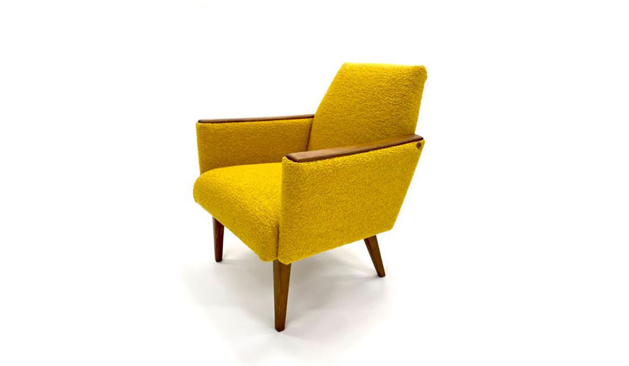 a textured yellow upholstered armchair by Hannah O'Hare