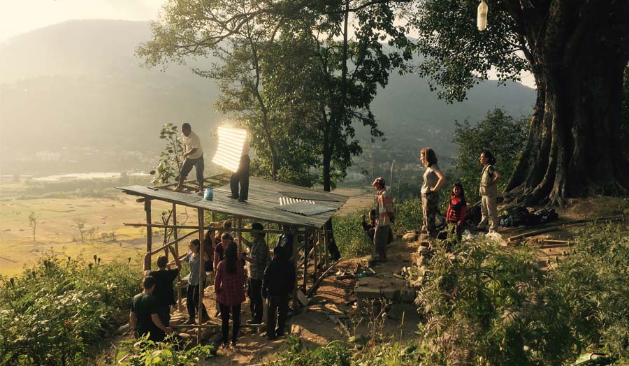 Photograph of Unit 6 students building a rest stop with farm workers, November 2015.