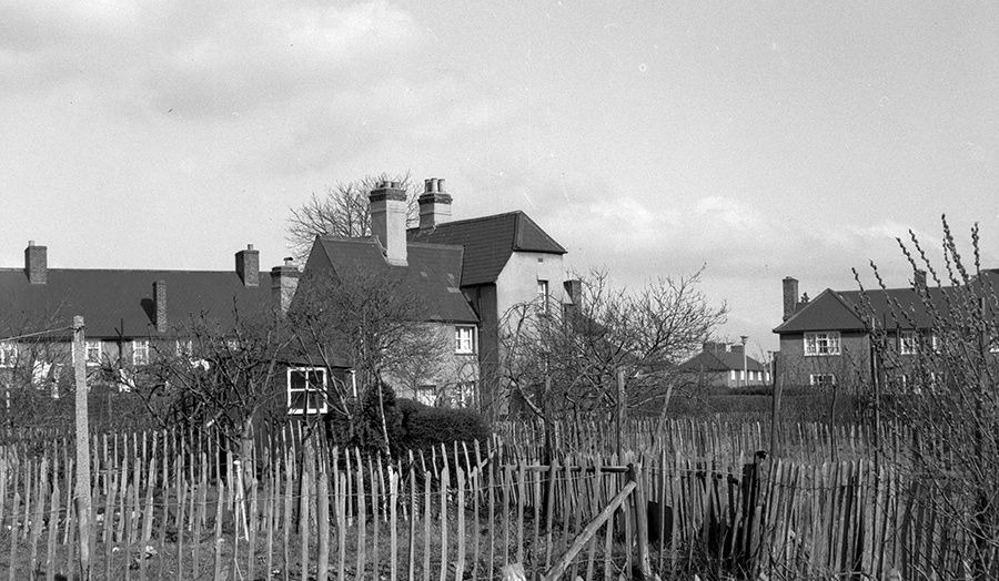 A photograph showing post-war houses and fencing on Becontree Estate, by Egbert Smart (1968)