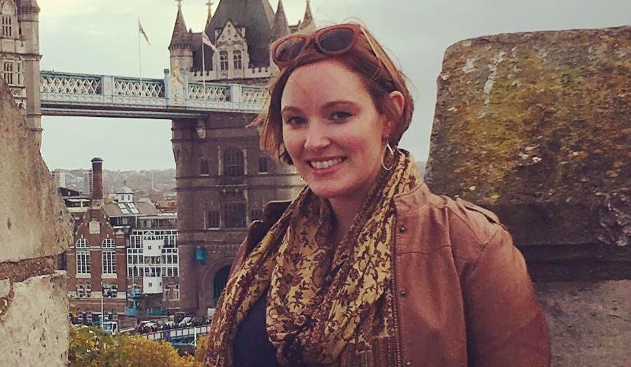 Photo of lady with red hair in front of London's Tower Bridge