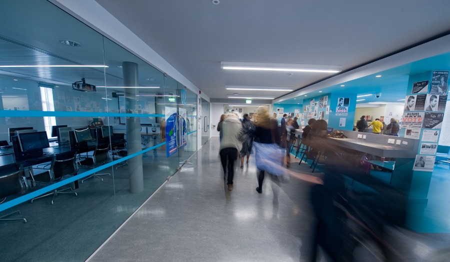 People walking through London Met's Blue lounge