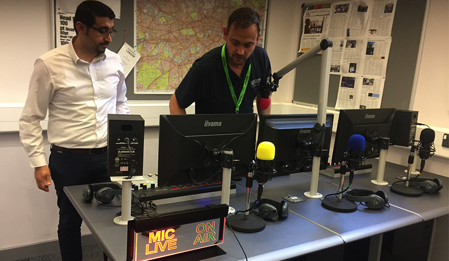 Radio self-op studio in reporters' room with on-air mic