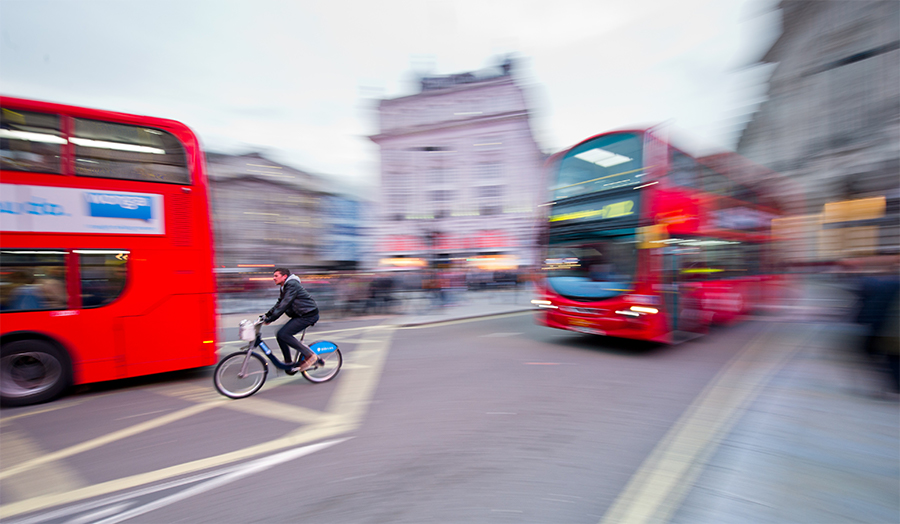 An image of a busy road by Trafalgar Square