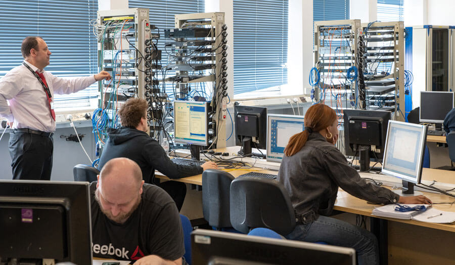 Students working in a computer networking lab