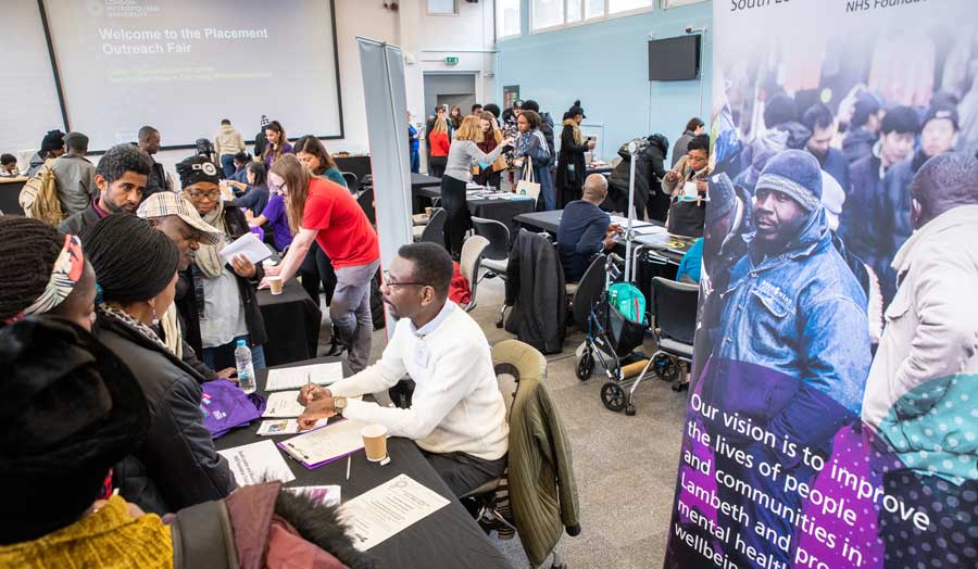 Students discussing with recruiters at the Placement Outreach Careers Fair at London Met