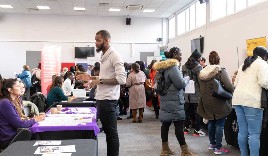 Student speaking with a recruiter at the Placement Outreach Fair.
