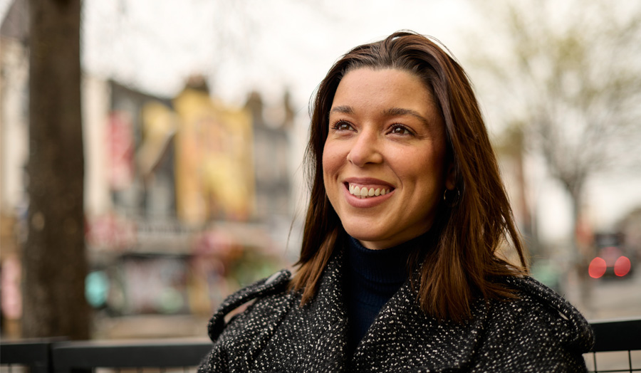 London Met graduate Nayara wearing a black coat