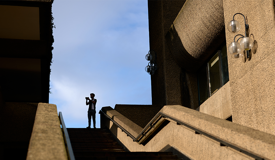 Daniyal at the Barbican pictured as a silhouette with his camera