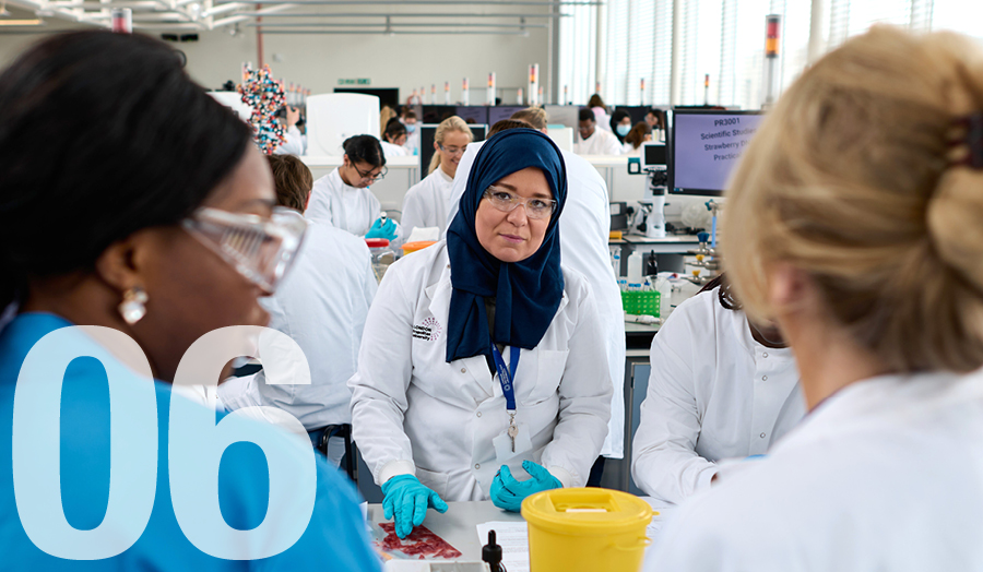 Students in the Uni's superlab with the number 06 for June superimposed