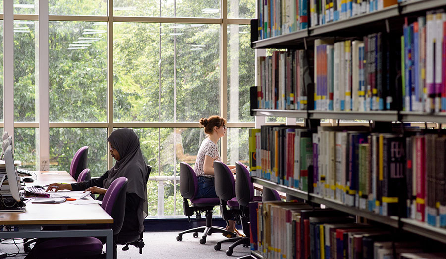 Two students in the Holloway Road library