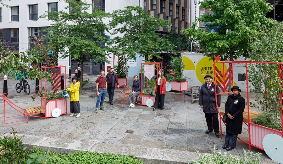 Staff and students on site with their contemporary barrow planters