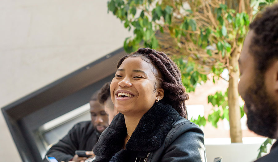 Students laughing in the Grad Centre 