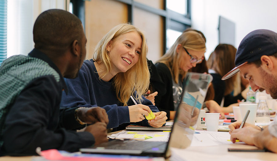 Students working at a laptop