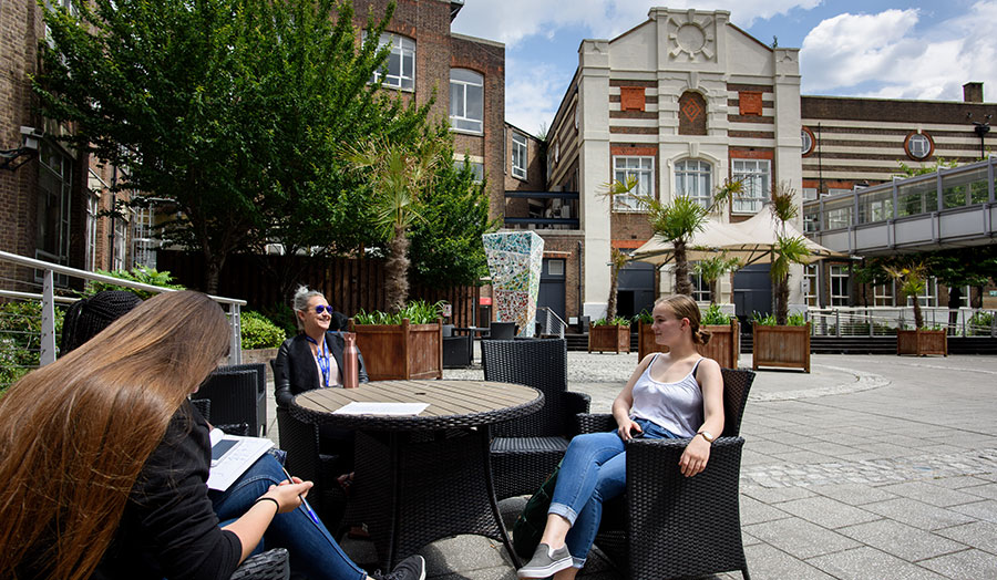 Students sitting in courtyard