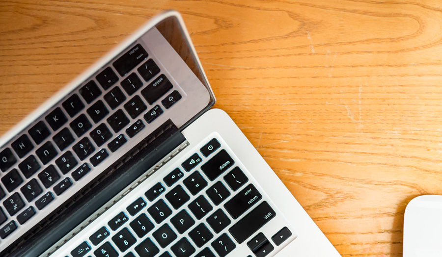 Image of laptop on wooden desk 