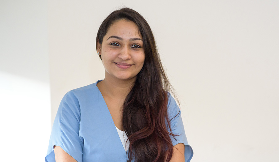 Female student Princee Kalra smiles