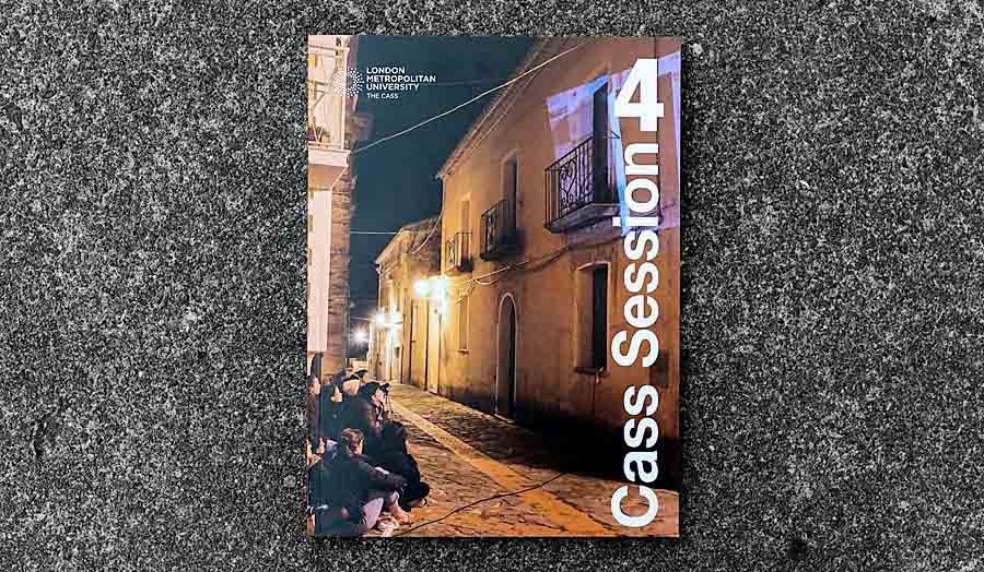 Photograph of cass yearbook taken against a concrete background