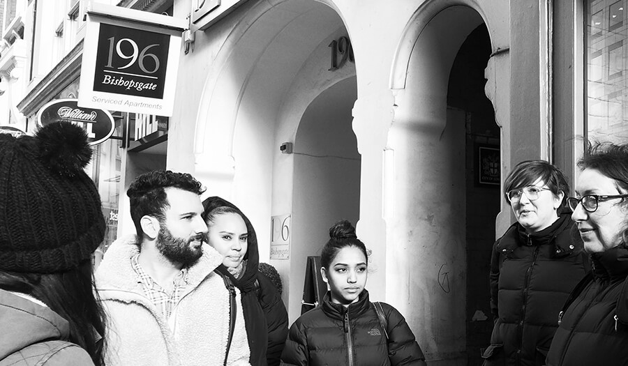 group of students in street exploring spitalfields