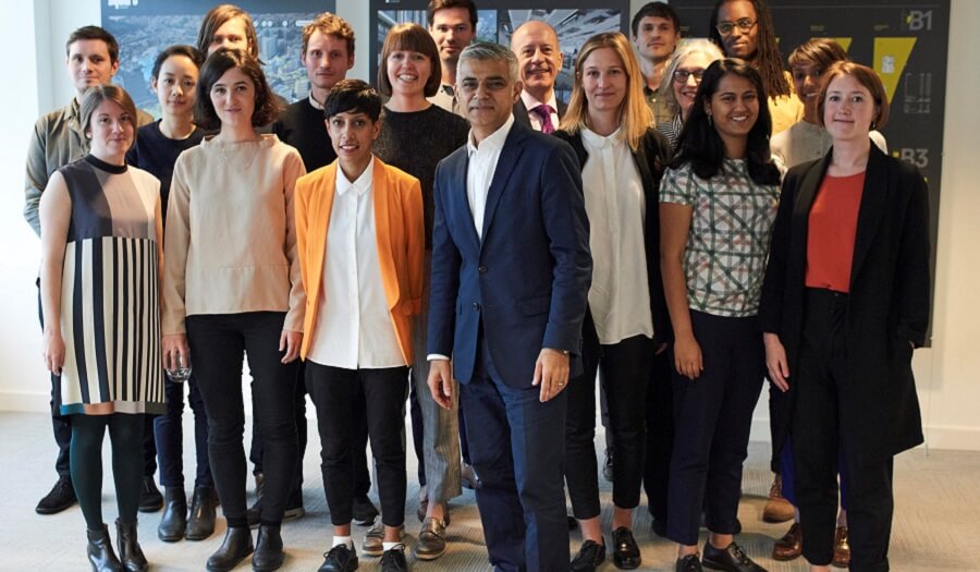 Group of people surround mayor of London Sadiq khan