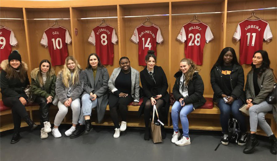 Student journalists in the locker room at Arsenal FC