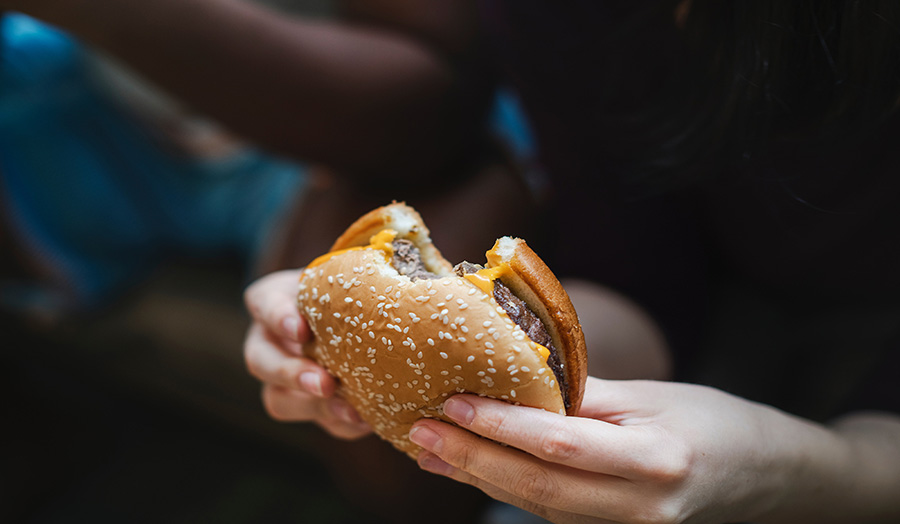 Person eating junk food