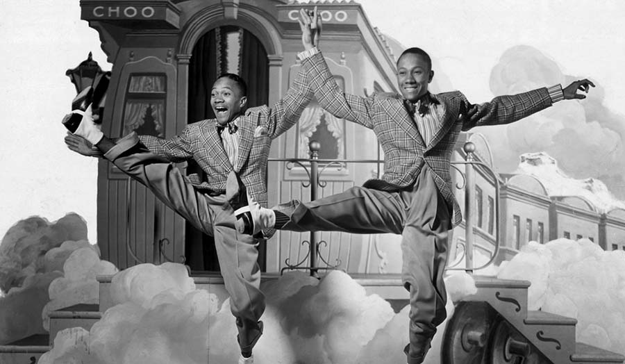 A film still of the Nicholas Brothers dancing