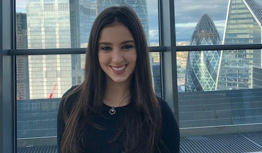 woman in front of London skyscrapers