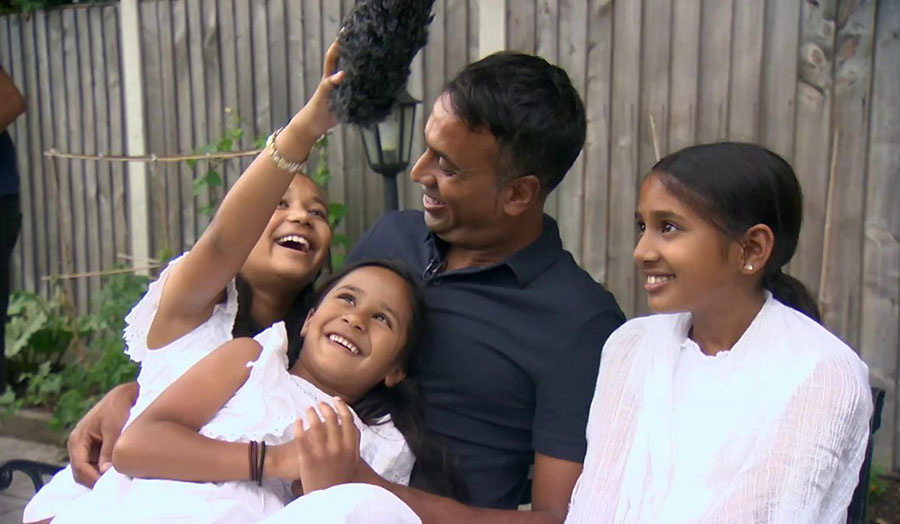 A film still from the documentary of Aminul Hoque and three Bangladeshi girls laughing