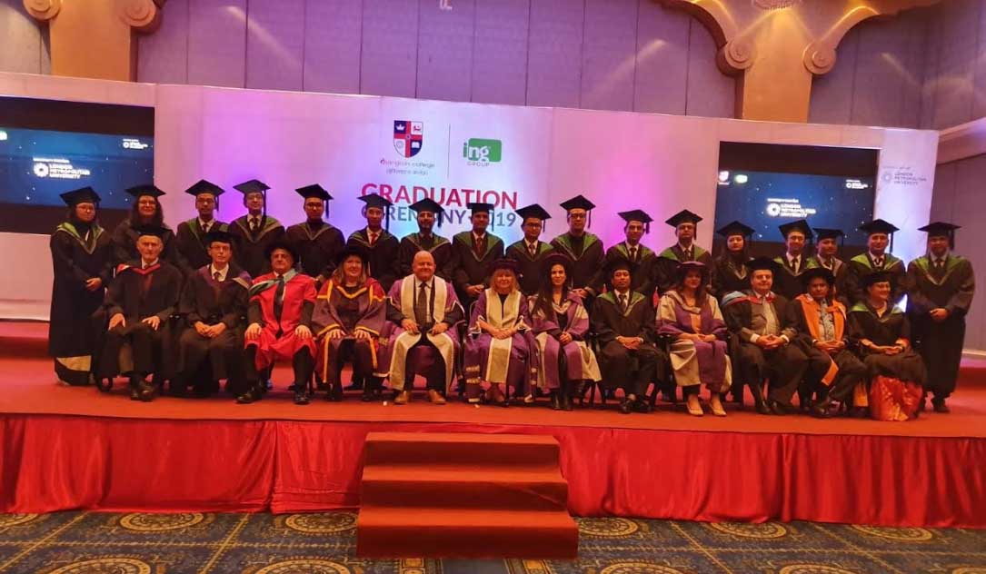Vice-Chancellor Lynn Dobbs poses for a photo with Islington College graduates in Kathmandu