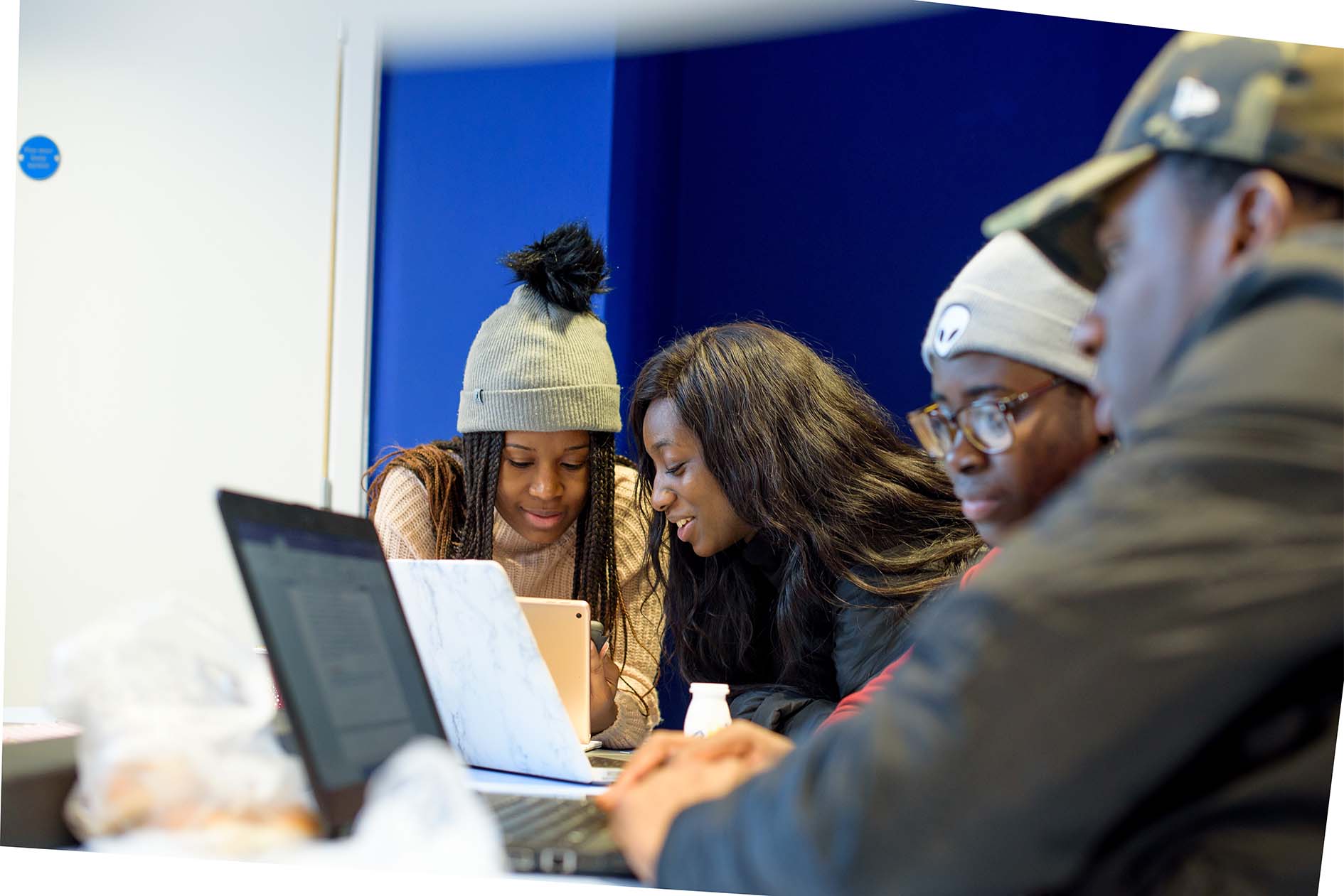 Students working at a computer in the Roding Bulding