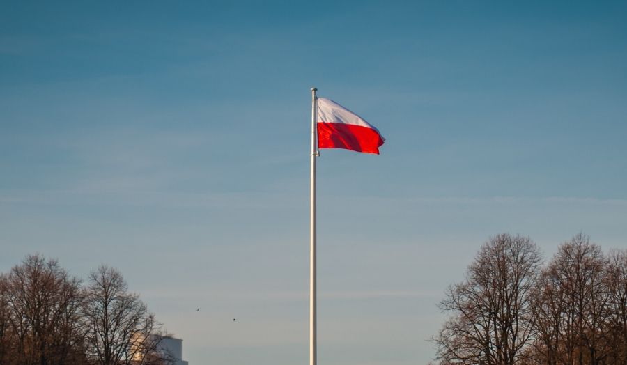 The flag of Poland on a pole.