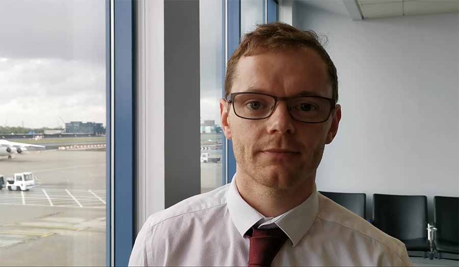 Ben Harrison standing in front of an aeroplane