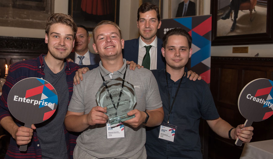 students holding a trophy